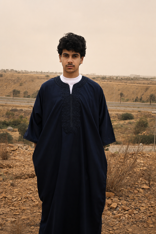 A man wearing a Navy Blue Moroccan Thobe.